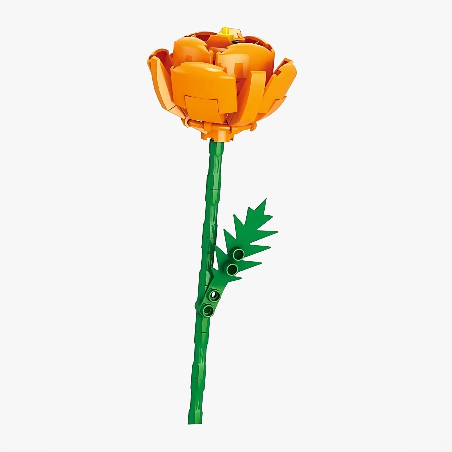 A toy yellow rose made of interlocking bricks on a white background