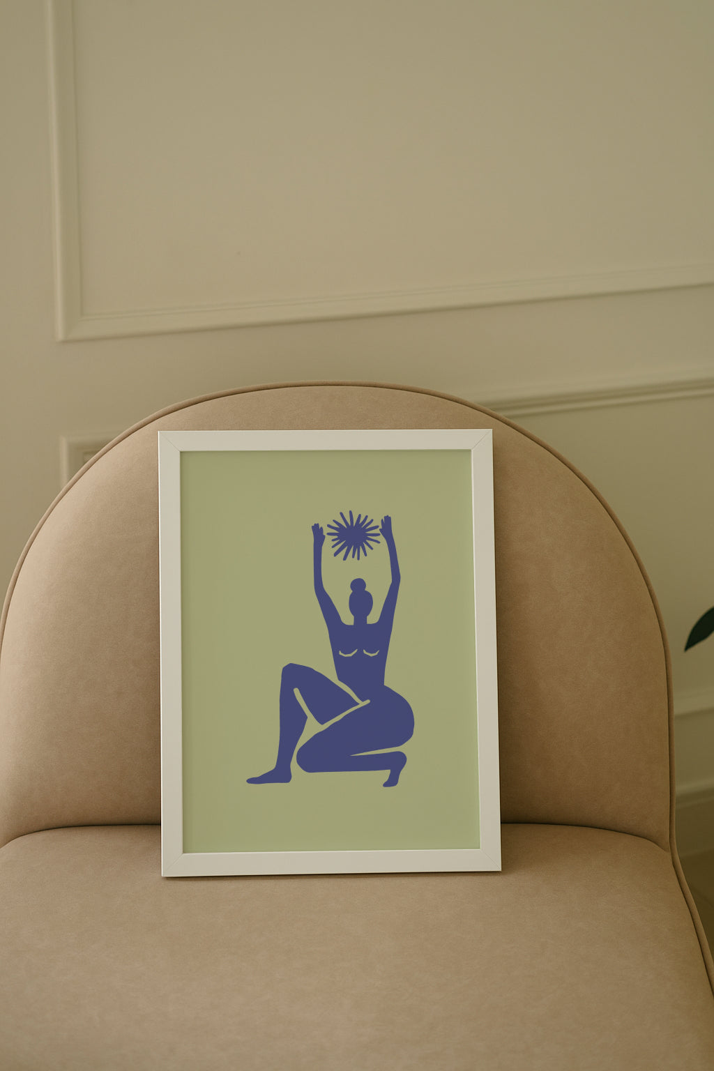 Framed poster with white frame and matisse art print on sofa