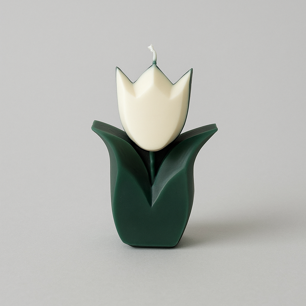 Candle shaped like a tulip with a white flower and green vase on a light gray background